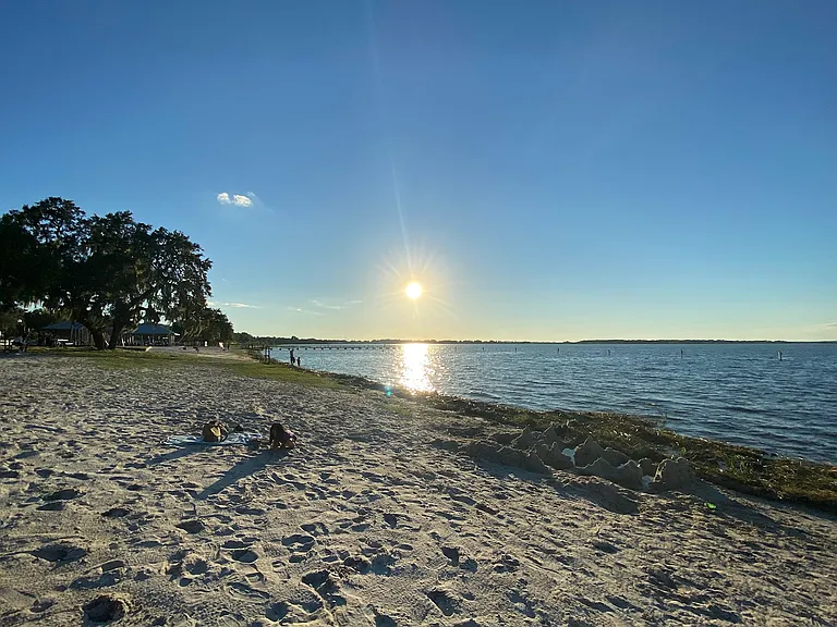 Soft white sand beach by Lake Minneola only few blocks away