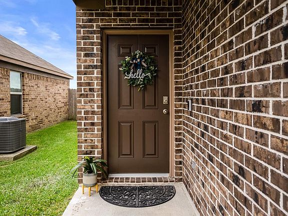 Welcoming covered front porch leads you into a home that offers a lot for your families needs.