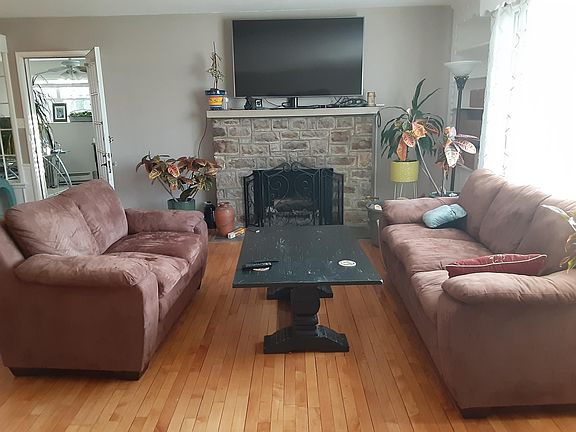 Living room. Door on left is entrance to office/bedroom.