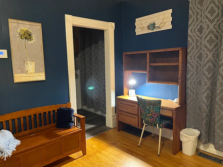 Desk and bench (with extra bed linens)