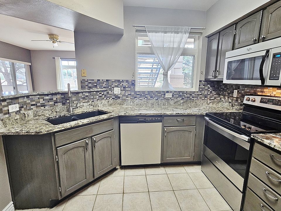 Custom Granite Kitchen, Glass Tile Backsplash, Stainless Steel Appliances, Black Composite Granite Dual Bowl Sink