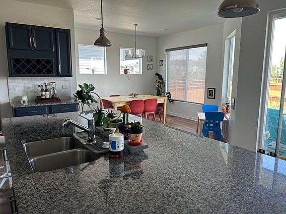 Kitchen with granite countertops and stainless appliances.