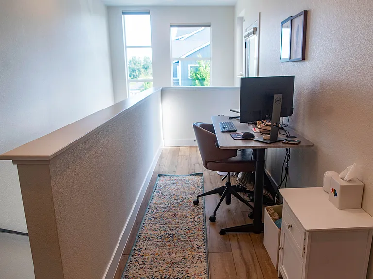 Upstairs office nook. Door to upstairs patio.