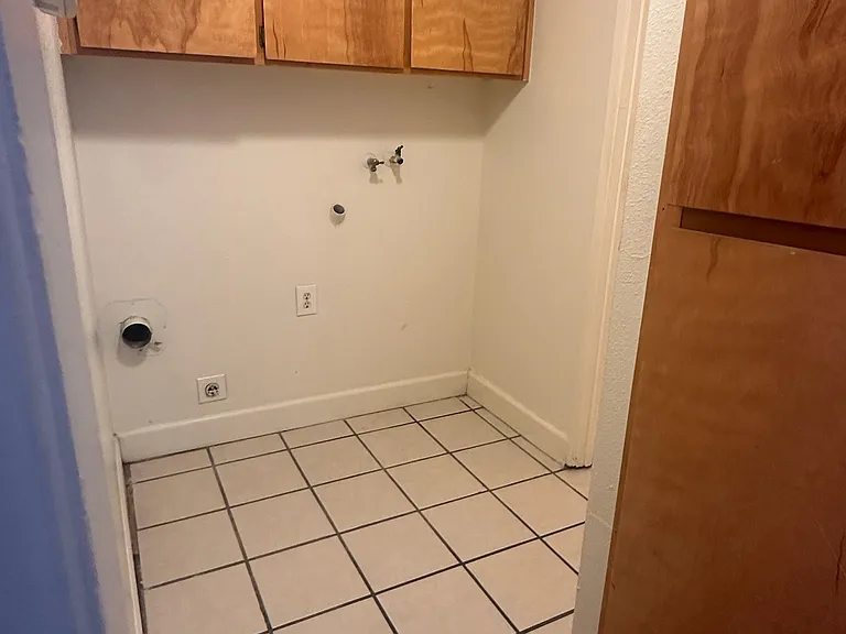 Washer/dry hookups and laundry storage.