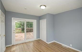 main floor bedroom walk out to deck or can be used as family