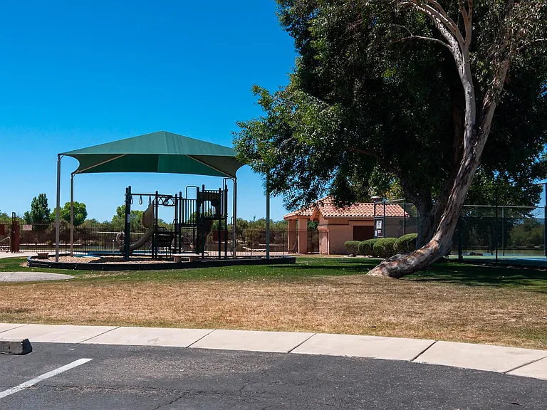 playground next to community recreation center, tennis courts and a basketball ground on right (not visible)