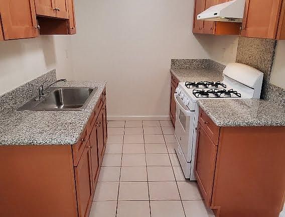 Granite countertop. Tenant provides own refrigerator.