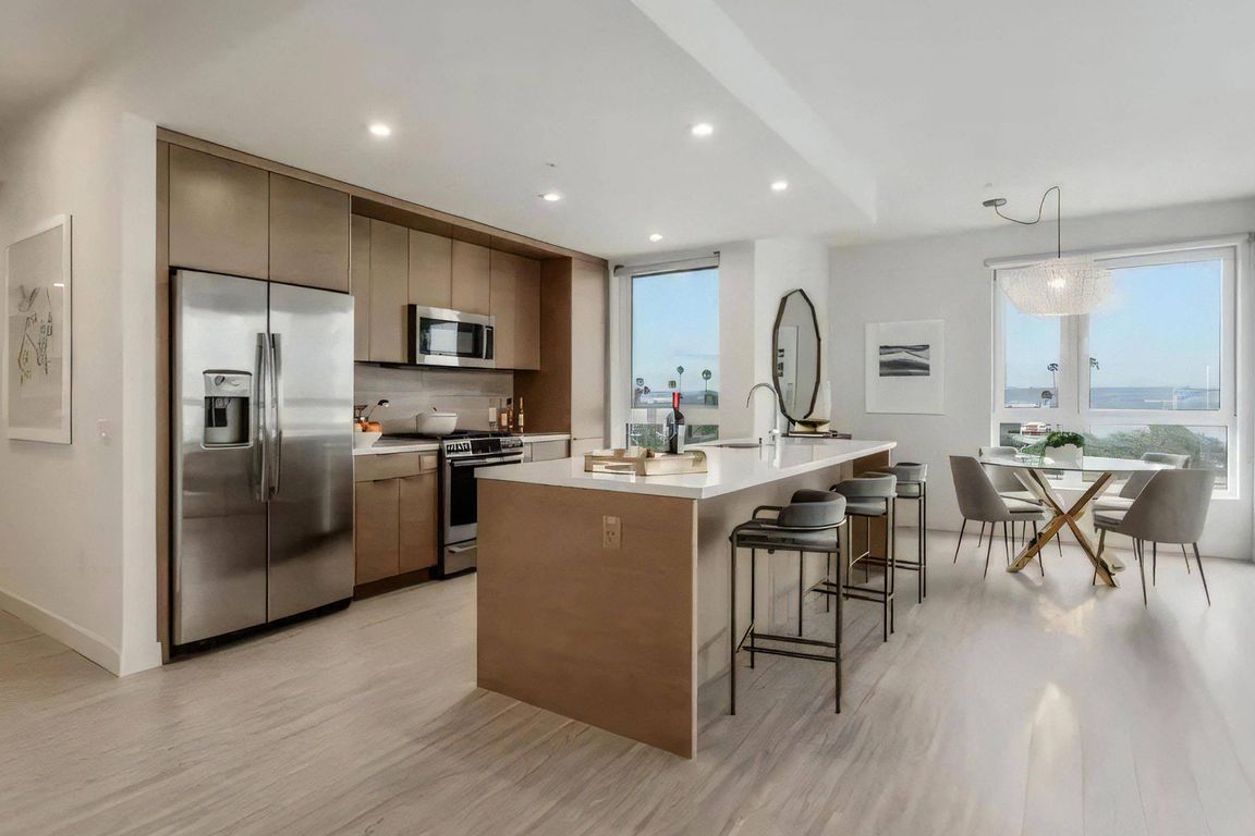 A kitchen island seats three, so cooking happens right beside company.
