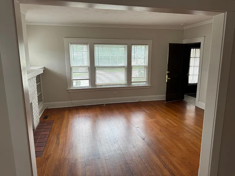 View from dining room into the Front Room with the front door open