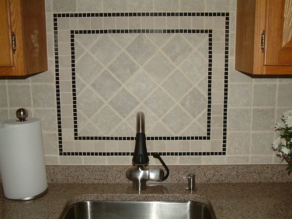 Kitchen - Travertine backsplash, Grohe faucet, & Silestone countertop