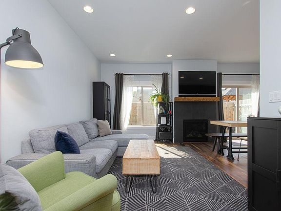 Great Room Open Floor Plan w/Gas Fireplace, Adjustable Television Wall Bracket, and Dimmable Recessed Overhead Lighting,