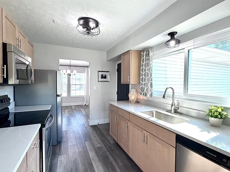 Huge window over the kitchen sink for a bright and cheerful space!