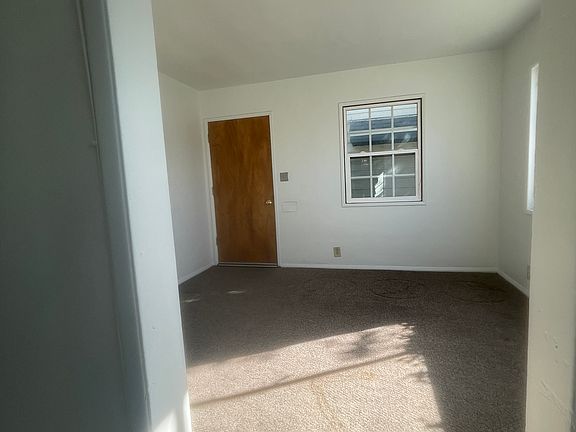 View of living room from kitchen and kitchen nook