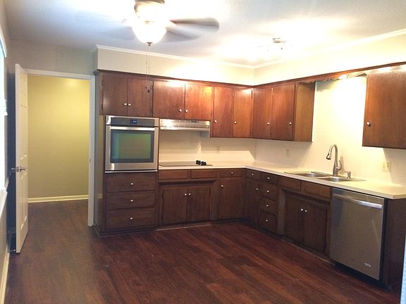 newer kitchen appliances, door to laundry room