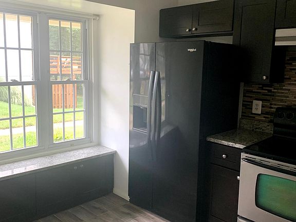 5th image of 8767 Village Green Ct