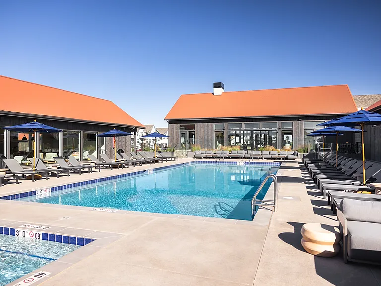 Poolside patio with fireside lounge seating