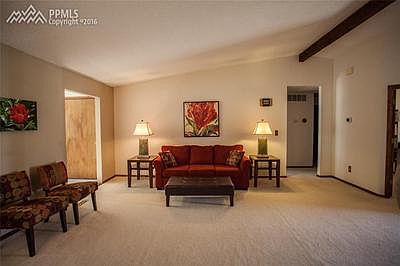 Vaulted ceilings and beautiful carpet in the main living room.
