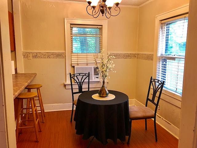 Light, bright dining area open to kitchen