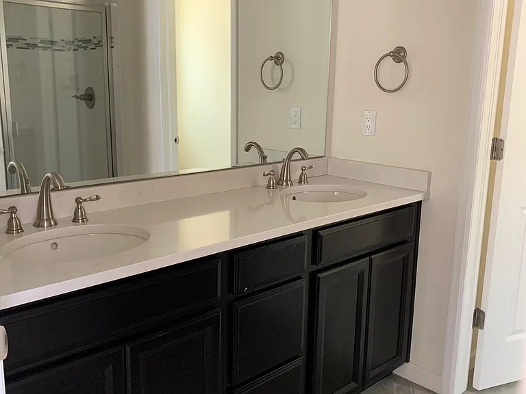 Double sink, water closet, Main bedroom suite located upstairs
