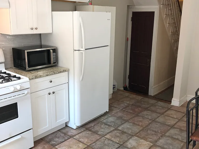 Remodeled kitchen and basement access with washer and dryer