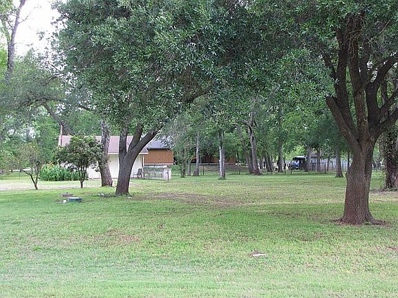 FROM THE STREET LOOKING AT THE HOME SITE