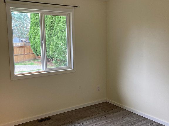 Bedroom 2 also has a light/ceiling fan combo.