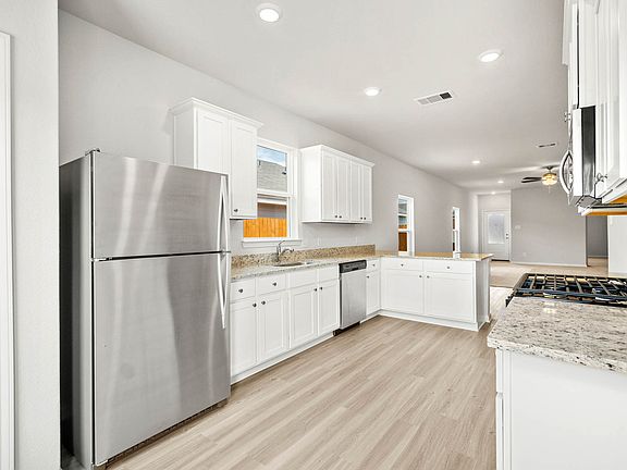 Your new kitchen includes a full suite of stainless steel appliances by Whirlpool.