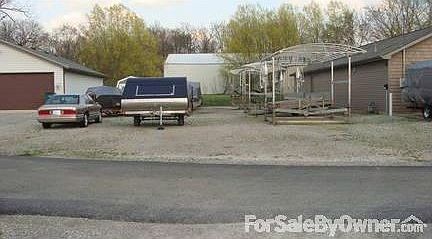 Back propery
						:
						Back portion of the property used for parking or possibly a pole barn.