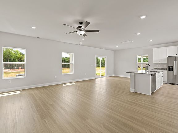 The dining room flows perfectly into the living room and kitchen