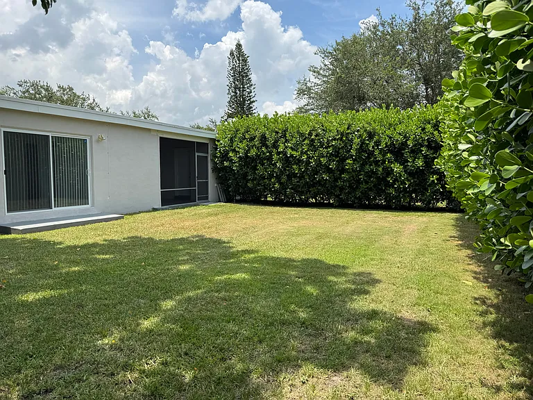 The totally private, fenced, landscaped back yard.
