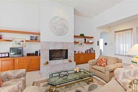Spacious Living Room with Fireplace and Custom Built-ins.