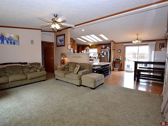 Nice sized living room with open design leading into dining area and kitchen.