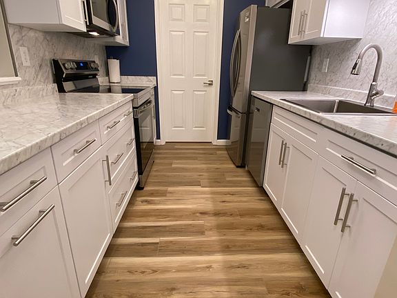 Completely renovated top floor condominium with elevator and garage.