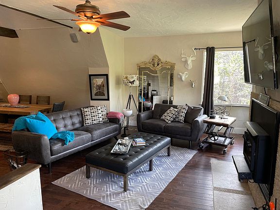 Cozy open living room TV and fireplace