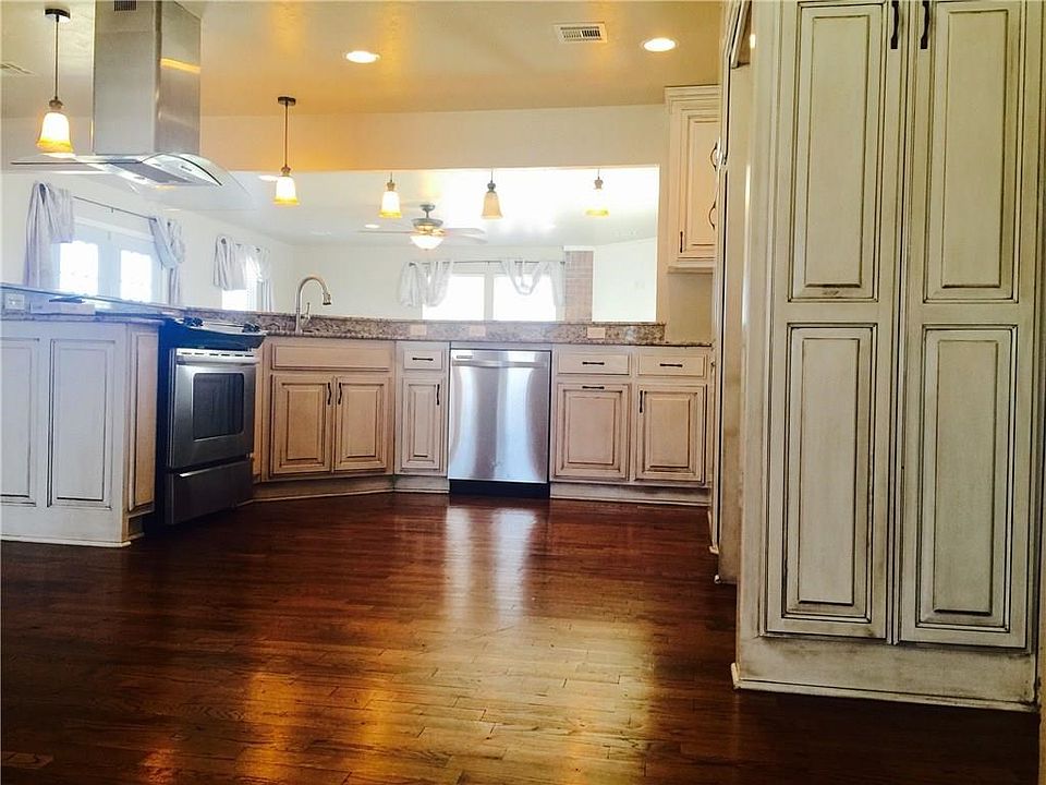 See the original wood floors glistening, it is like that throughout the house.  Glam kitchen remodel too!