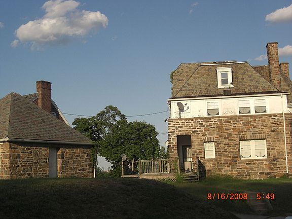 Back of house with detached garage