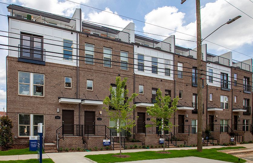 Modern Exteriors with Brick and Roof Top Terraces facing the city skyline