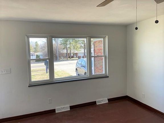 Living Room - newly finished hardwood floors, NEW windows, NEW ceiling fan