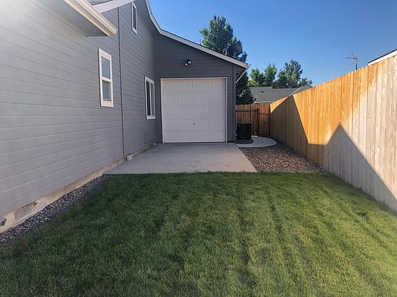 Garage bay with drive out pad (view from back)