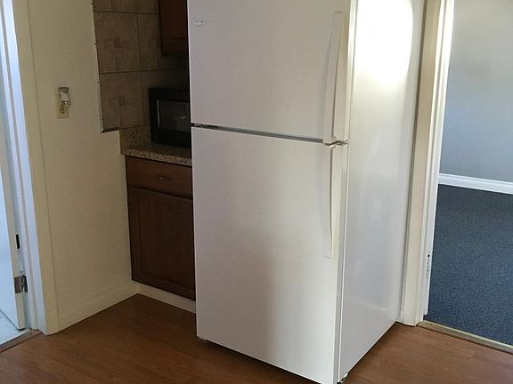 Kitchen with refrigerator and microwave included.