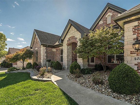 The elevation features extensive masonry artistry using a combination of stone and brick creating a timeless look of exceptional detail.  The corner have been accented with stone quoins that draw your eyes to the soaring roof lines.