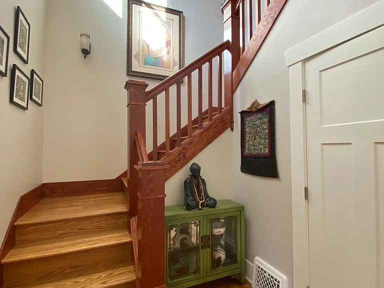 Entryway - stairs to upper level bedrooms and large front hall closet for coats, shoes, storage it's huge
