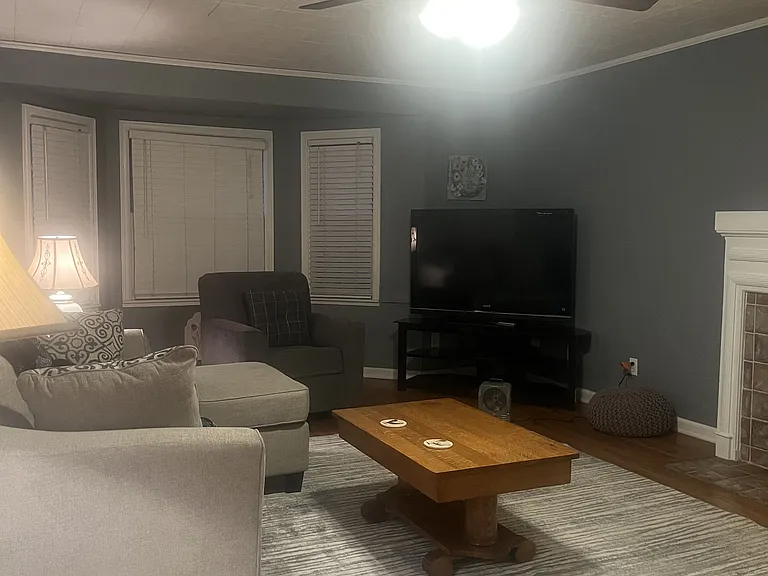Living room _ Comfortable seating area with sectional sofa and flat-screen TV