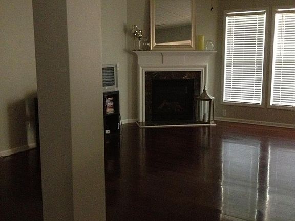 Living room with fire place and wood
