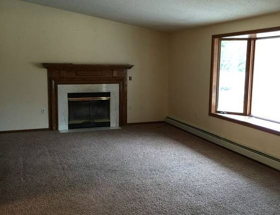 The living room has a real fireplace and is nice and large.
