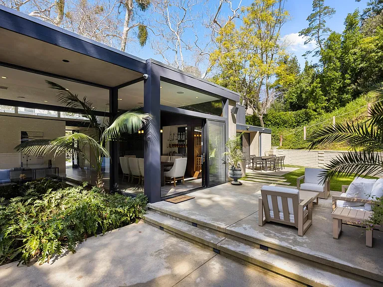 Relax in the outdoor seating area, offering comfort and tranquility for unwinding in the fresh air.