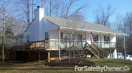Full front porch, wrap-around side deck
						:
						Beautiful Pink dogwood on the corner, side door from the bonus room to deck