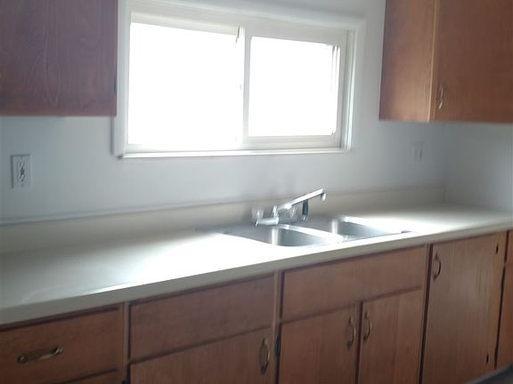 1 of the walls of cupboard in the large eat in kitchen