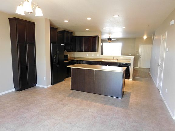 Full view of dining, kitchen to livingroom