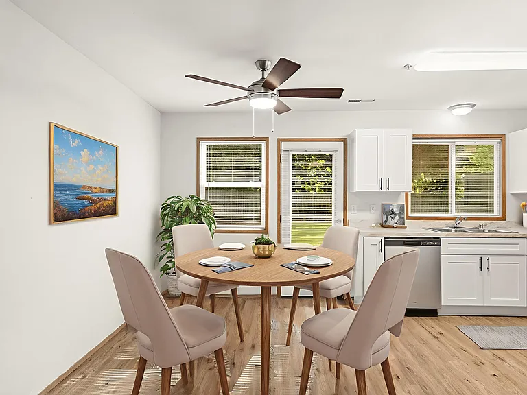 Bright and welcoming dining area, virtually staged to showcase modern seating, natural light, and an open kitchen layout. Bright and welcoming dining area, virtually staged to showcase modern seating, natural light, and an open kitchen layout.